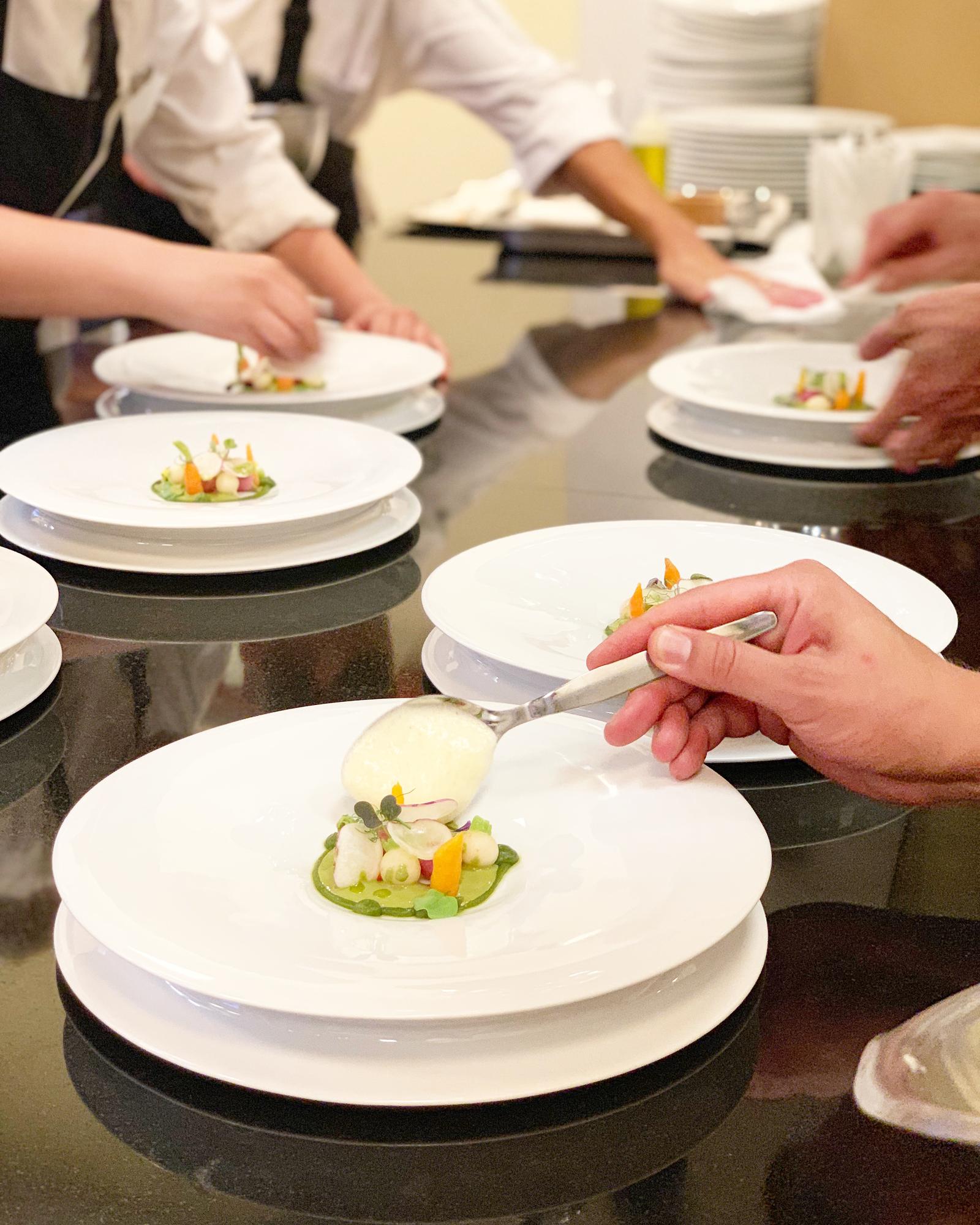 Workshop attendees plating dishes