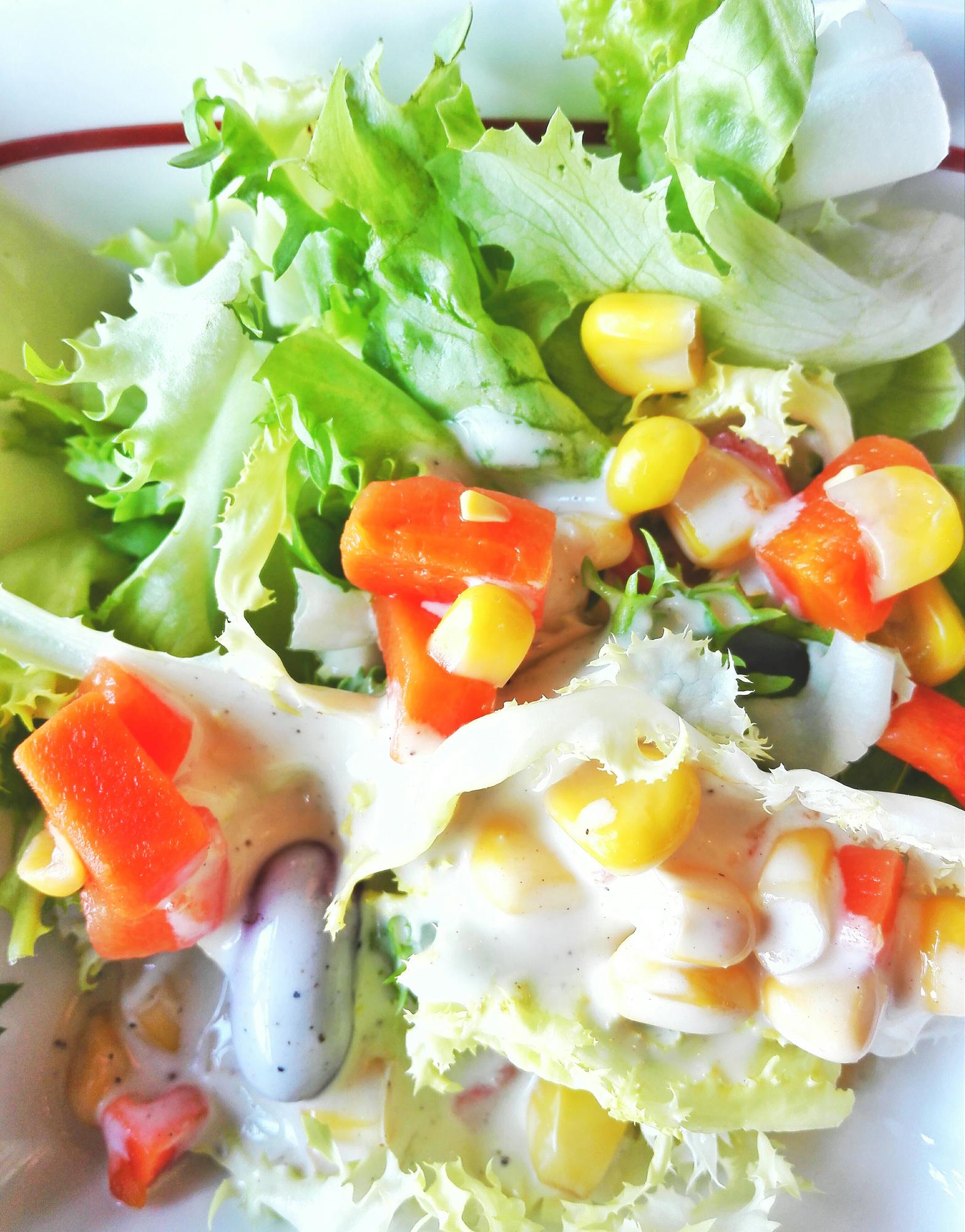 Close up of a composed salad with vibrant colors